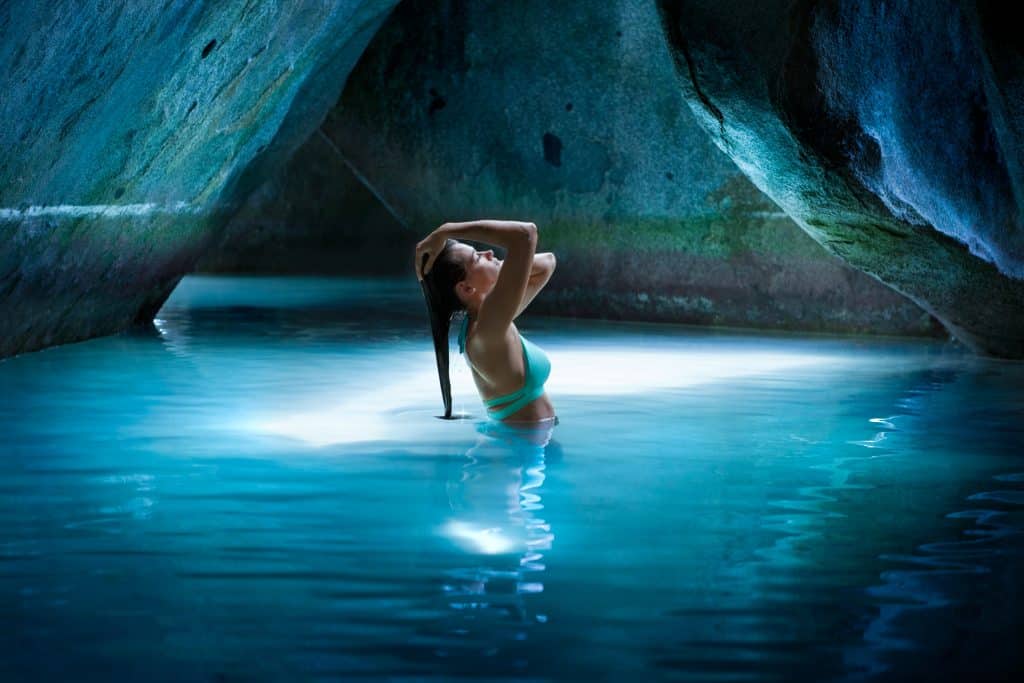 woman in the water, in a cave, teal bathing suit, Orlando, FL