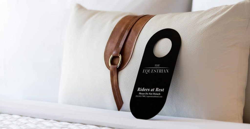pillow in the hotel room with a do not disturb sign, world equestrian center, orlando, fl