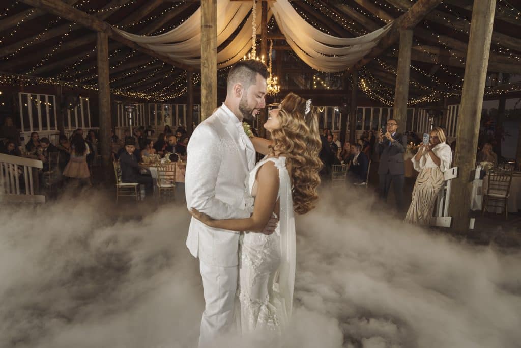 wedding couple on the dance floor, gazing into each others' eyes, fog rolling around them, paradise cove, central fl