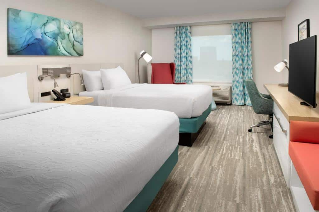 double queen beds, blue curtains, tv mounted on wall, wood panel floors, Hilton Garden Inn Orlando Downtown, Central FL