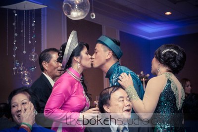 bride and groom kissing at their reception, wearing traditional Japanese wedding attire, P.S. I Love You Weddings & Events, Orlando, FL