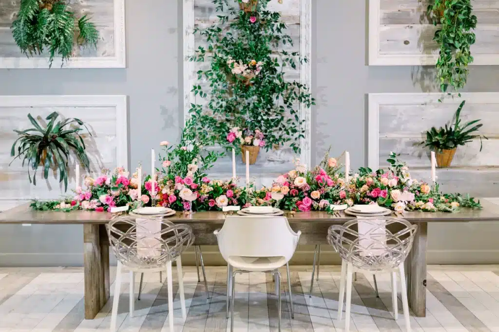 tablescape, pink flowers, tall white candles, table length centerpieces, plants on the wall, Central FL