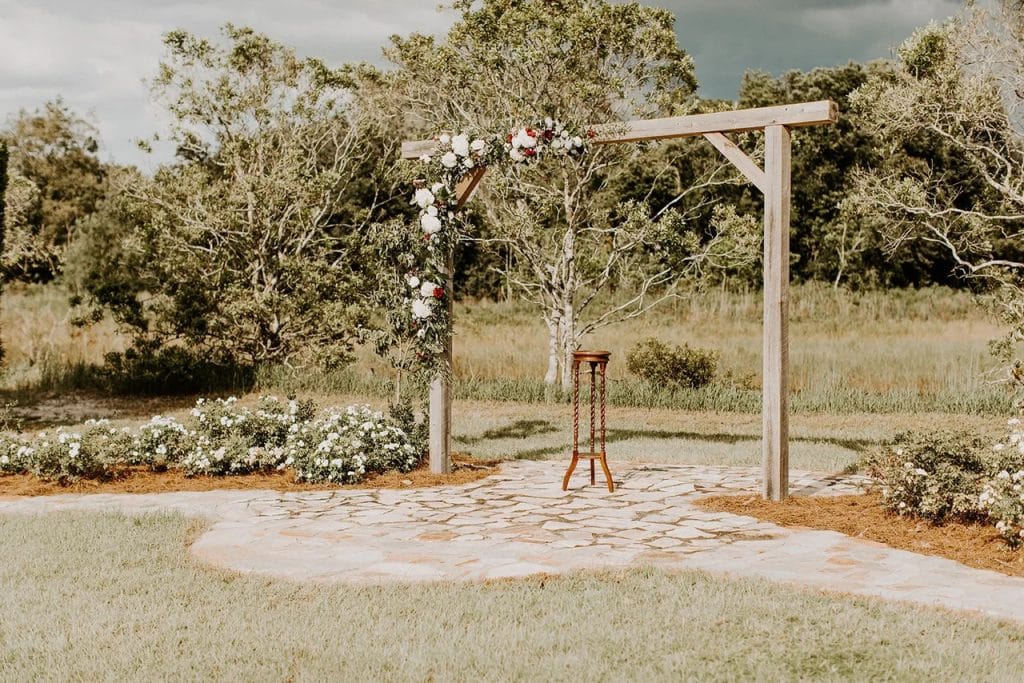 altar area with a pergola set up on a stone walkway, Orlando, FL