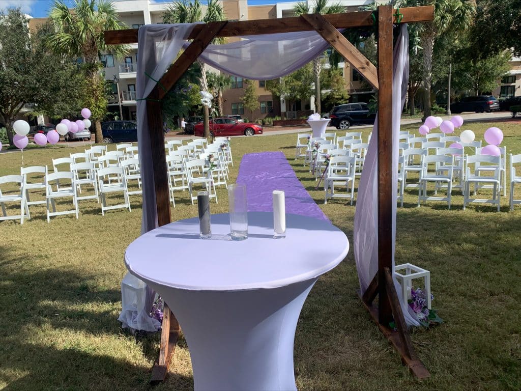 wedding ceremony set up, altar, high top table with candles, white chairs in rows, Oviedo Amphitheatre and Cultural Center, Central FL