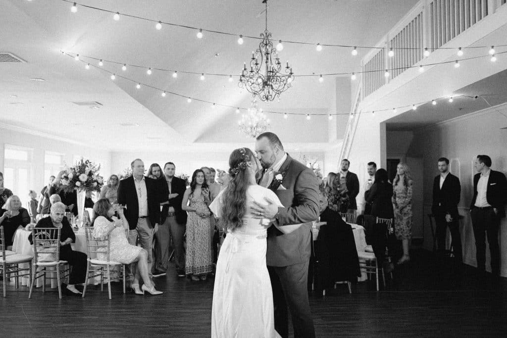 black and white photo, bride and groom dancing on the dance floor at their reception, Orlando, FL