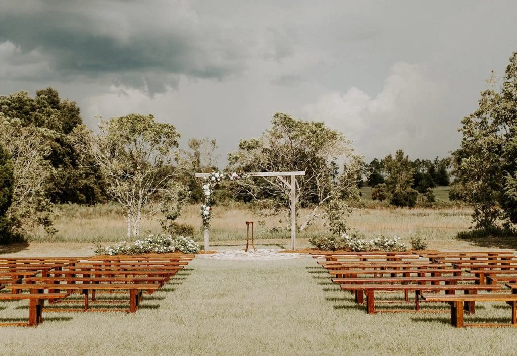 wedding ceremony set up, outdoors, wooden benches, Acres of Grace Family Farms, Orlando, Fl