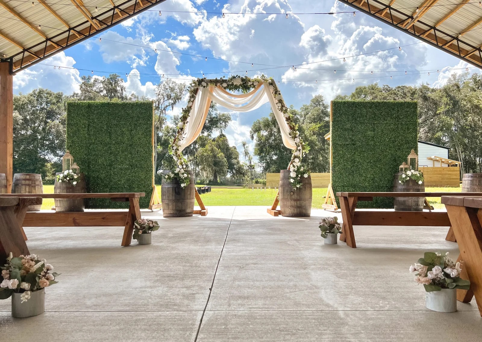 wedding set up, grass walls, pavilion, beautiful blue skies, picnic tables, Grass Campers, Orlando, FL