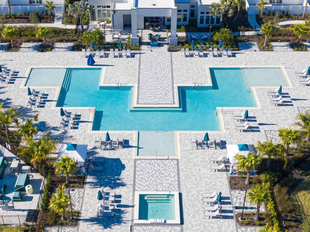 aerial view of the pool and patio, hot tub, lounge chairs, clear blue waters, Orlando, FL