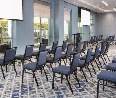 Chairs set up in the ballroom in rows, facing a screen, Hyatt House Orlando Airport