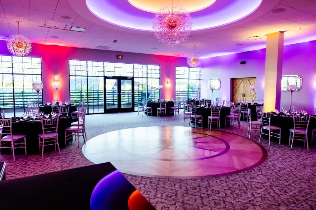 wedding reception, purple uplighting, dance floor, large floor to ceiling windows, New York Beer Project, Orlando, FL