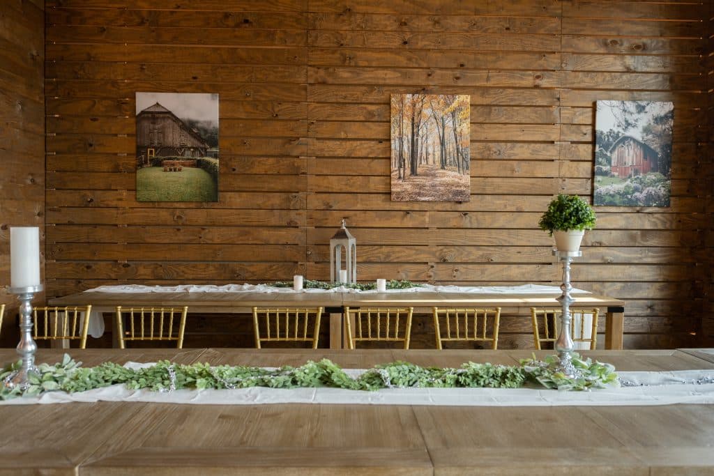 long table with white table runner and candles, wooden chairs, New York Beer Project, Orlando, FL