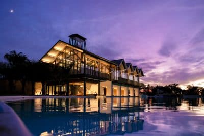 Evermore Orlando Resort, view at night, lights on, purple sky