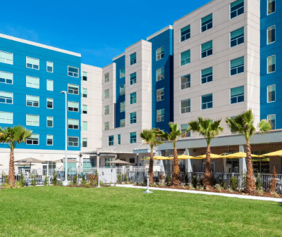 Hyatt House Orlando Airport, outdoor patio area, blue sky, Orlando, FL