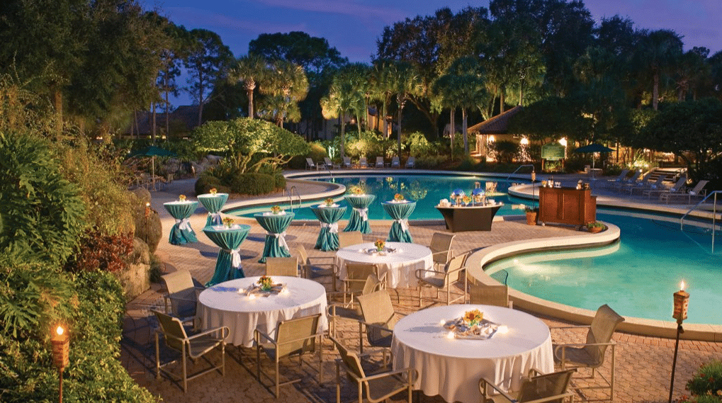 outdoor reception set up around the pool area, Evermore Orlando Resort, Orlando, FL