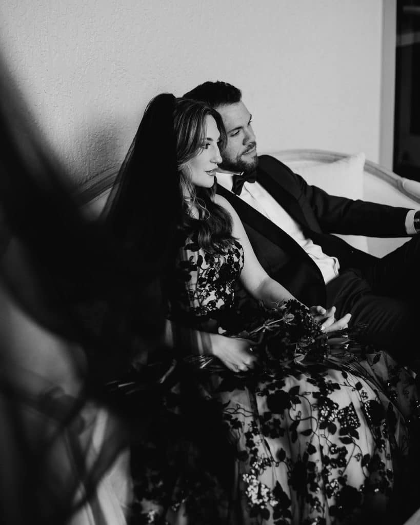 bride and groom sitting on a sofa, black and white photo, Orlando, FL