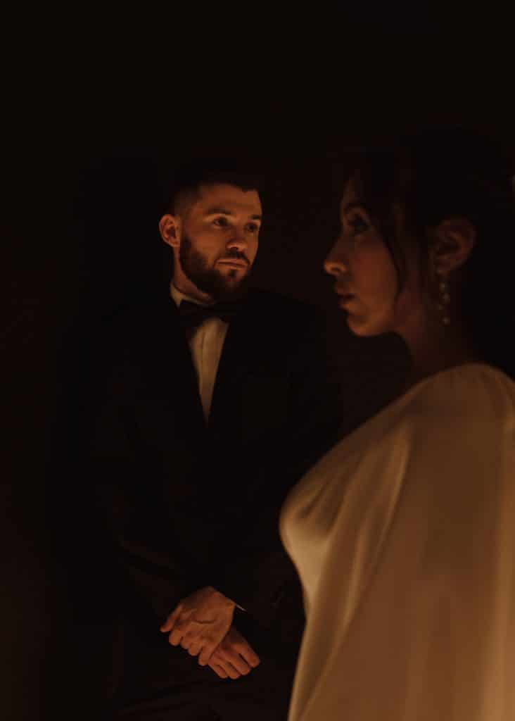 bride and groom looking at each other, dark lighting shot, orlando, FL