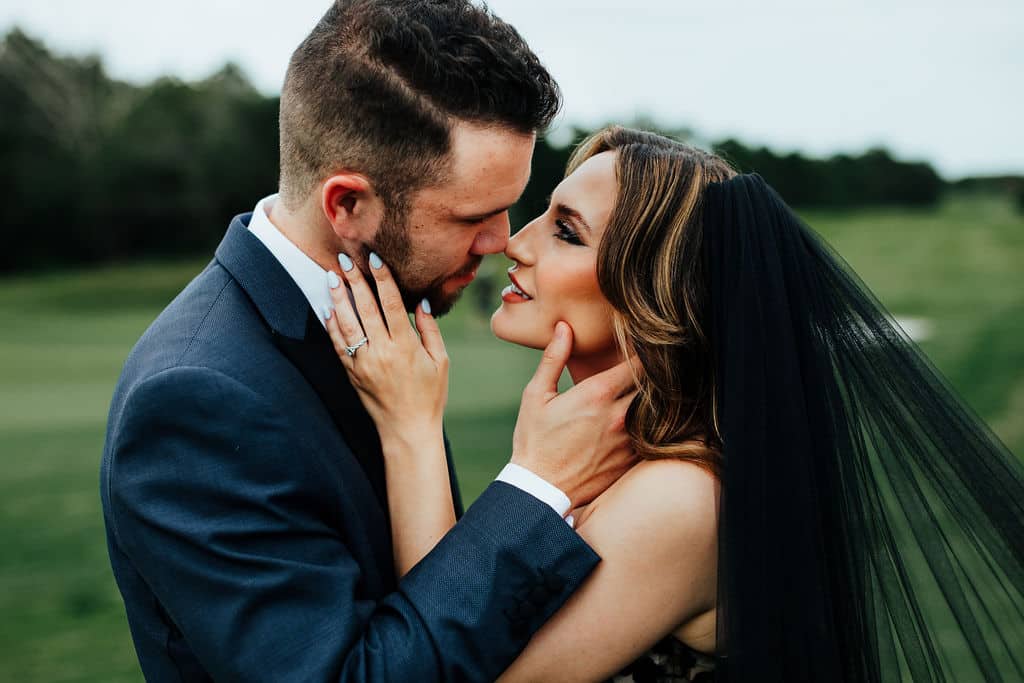 bride and groom embracing, outdoors, Orlando, FL