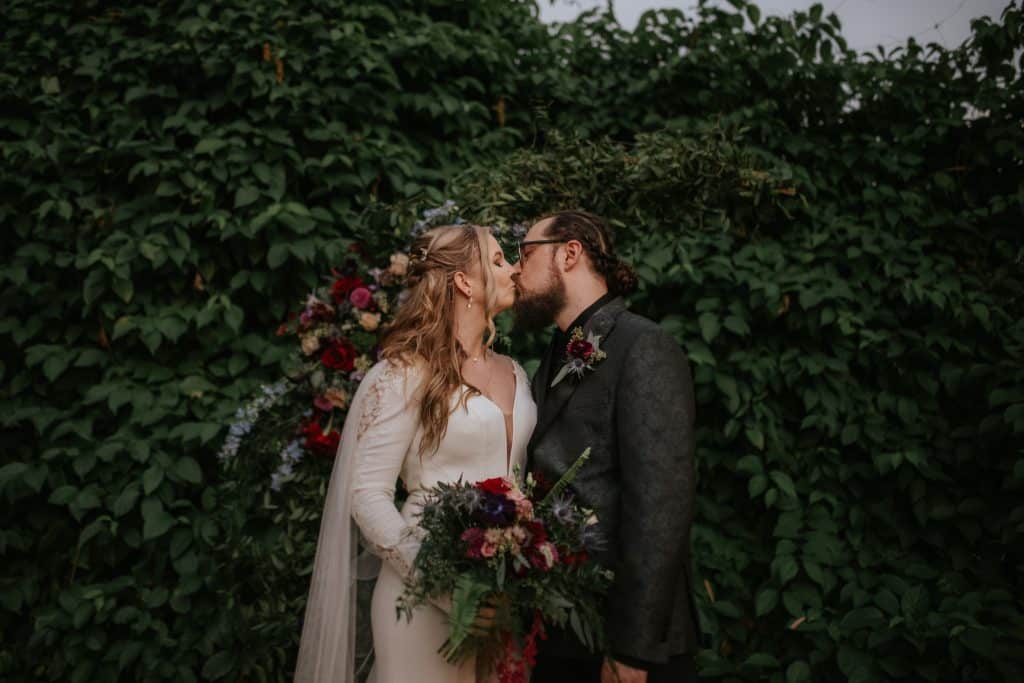bride and groom kissing outdoors, Orlando, FL