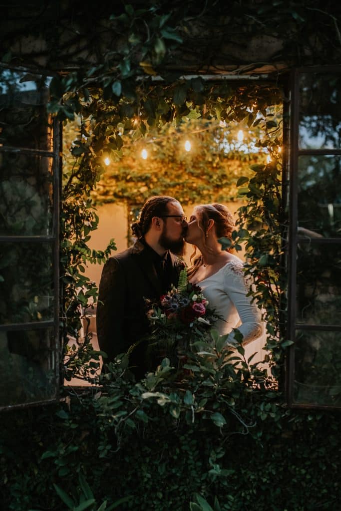 bride and groom kissing in the window, Perfectly Planned by Yas, Orlando, FL