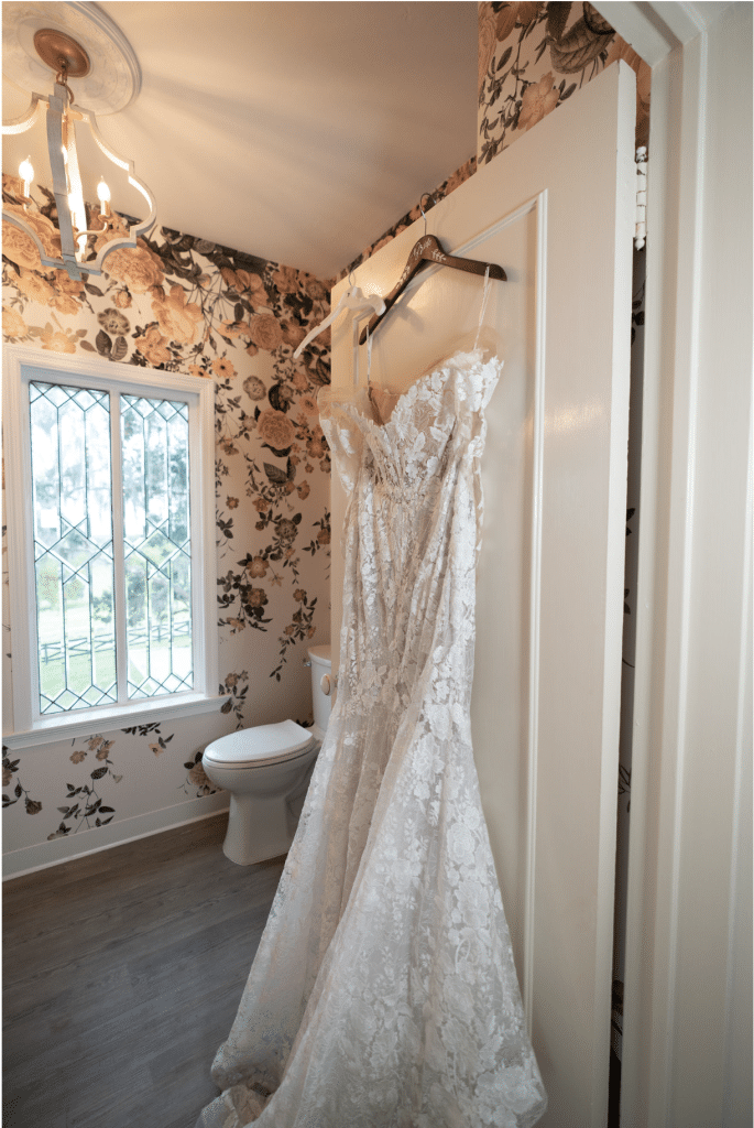 wedding dress hanging on the door of the bathroom, Orlando, FL