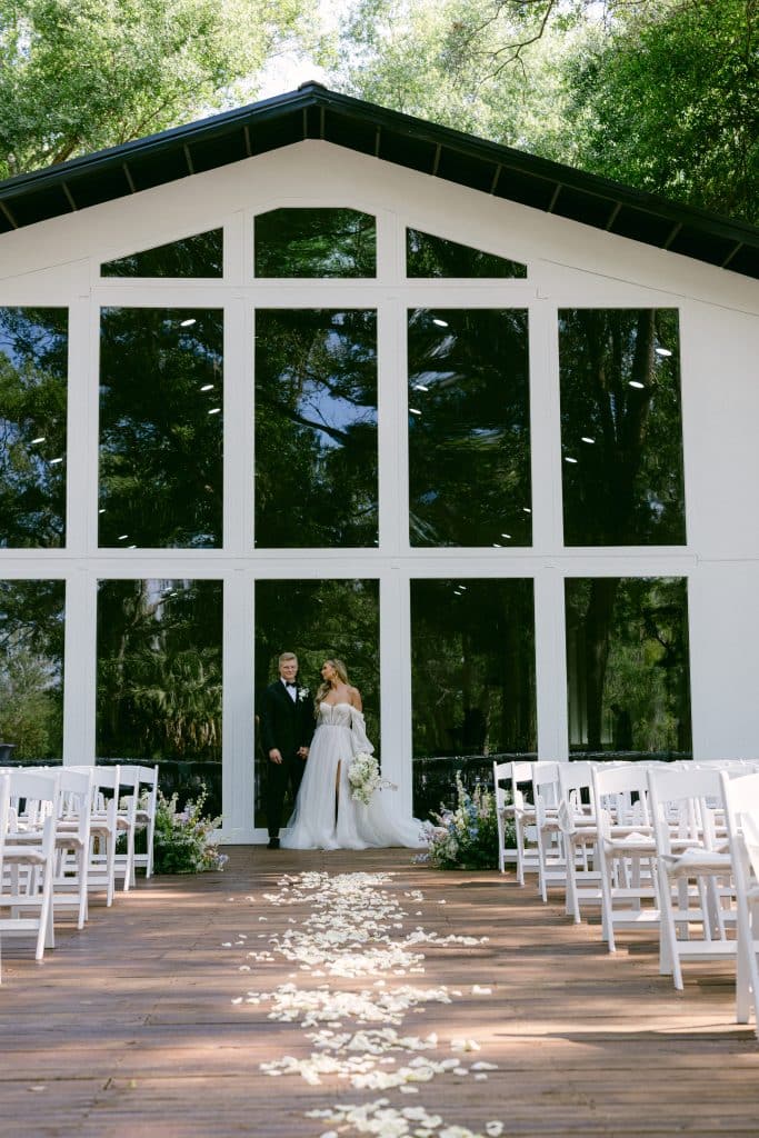 outdoor ceremony set up with white chairs, The Whitewood Ranch, Orlando, FL