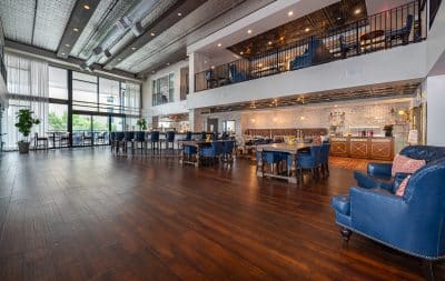 wide open view of the main floor, open space, blue chairs and wood tables, Orlando, FL