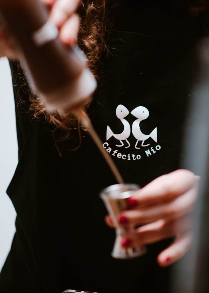 barista pouring syrup into an espresso cup, Orlando, FL