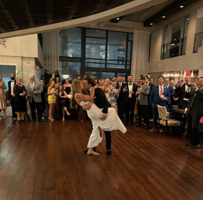 bride and groom dancing on the dance floor at their reception, guests watching, Orlando, FL