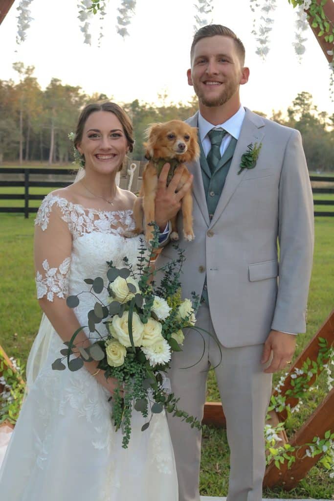 bride and groom with their puppy, on the ranch, Orlando, FL