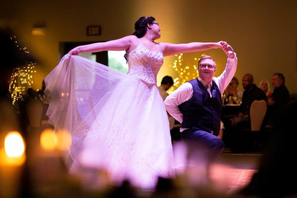 photo with the foreground blurred, bride and groom dancing, reception, Orlando, FL