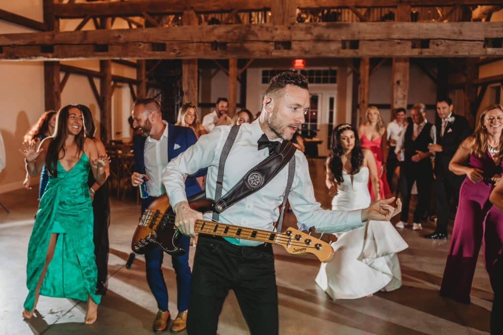 wedding guests dancing, man with his guitar, wedding reception, Orlando, FL
