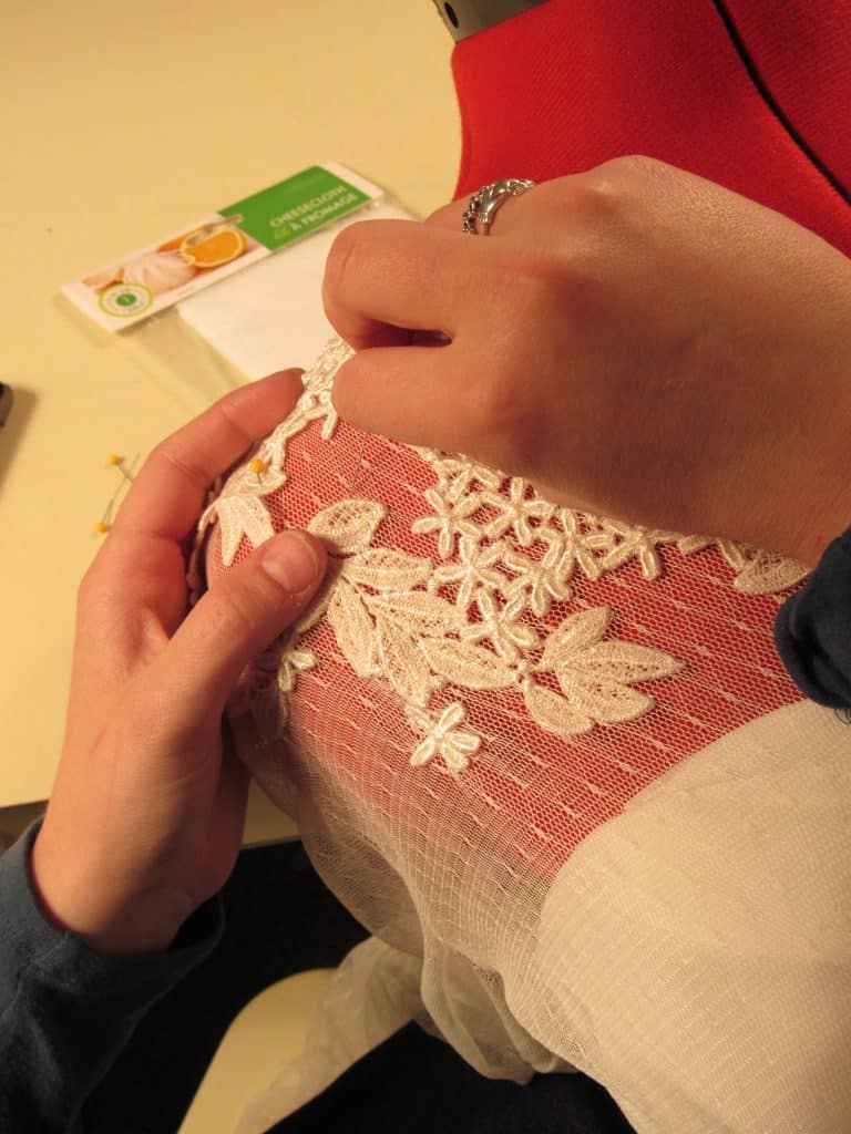 seamstress sewing a lace sleeve of a wedding dress, Sewing by Marilyn, Orlando, FL