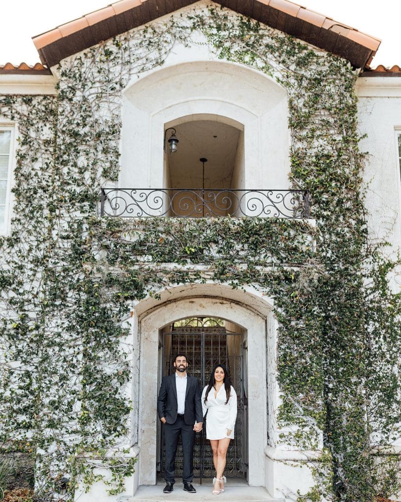 happy couple standing in the archway of their venue, Orlando, FL