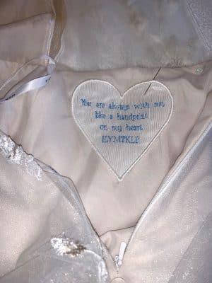 You are always with me like a handprint on my heart embroidered on a white fabric heart, sewn into a wedding dress, Orlando, FL