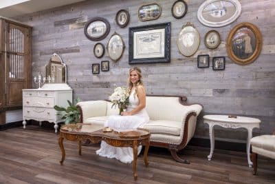 bride posing on the white sofa, in the bridal suite area, Orlando, FL