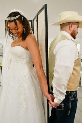 bride and groom holding hands, back to back before their wedding ceremony, Orlando, FL