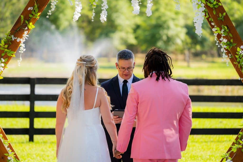 wedding couple at their wedding ceremony, outdoors, S&S Ranch, pergola, Orlando, FL