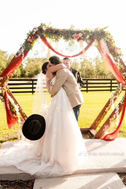 bride and groom kissing under the pergola, Orlando, FL