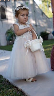 flower girl walking down the aisle with her basket of flower petals, S&S Ranch, Orlando, FL