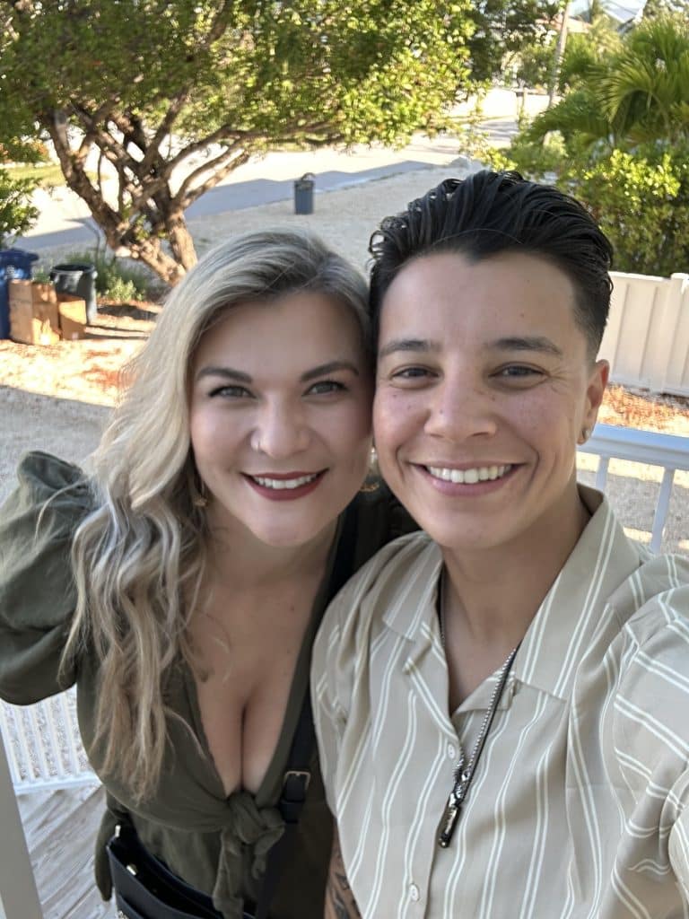 couple pose together smilng for selfie picture