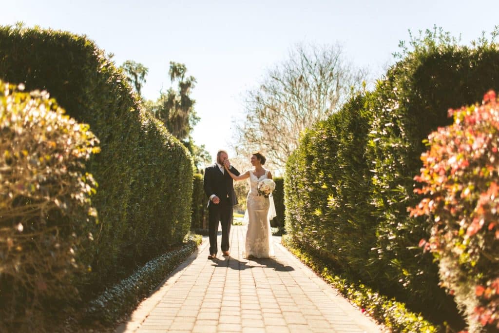 bride and groom walking through the garden, Golden Ocala Golf & Equestrian Club, Orlando, FL