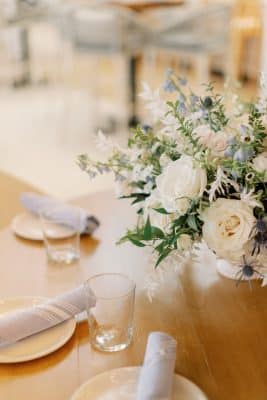close up of a table, white floral centerpiece, small plates, white napkins, Orlando, FL