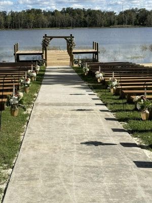 wedding ceremony set up, waterside, altar, long wooden benches, Orlando, FL