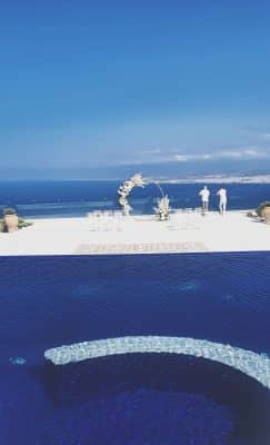 outdoor view of the wedding ceremony set up, water surrounding, Wine Dark Sea Villas, Orlando, FL