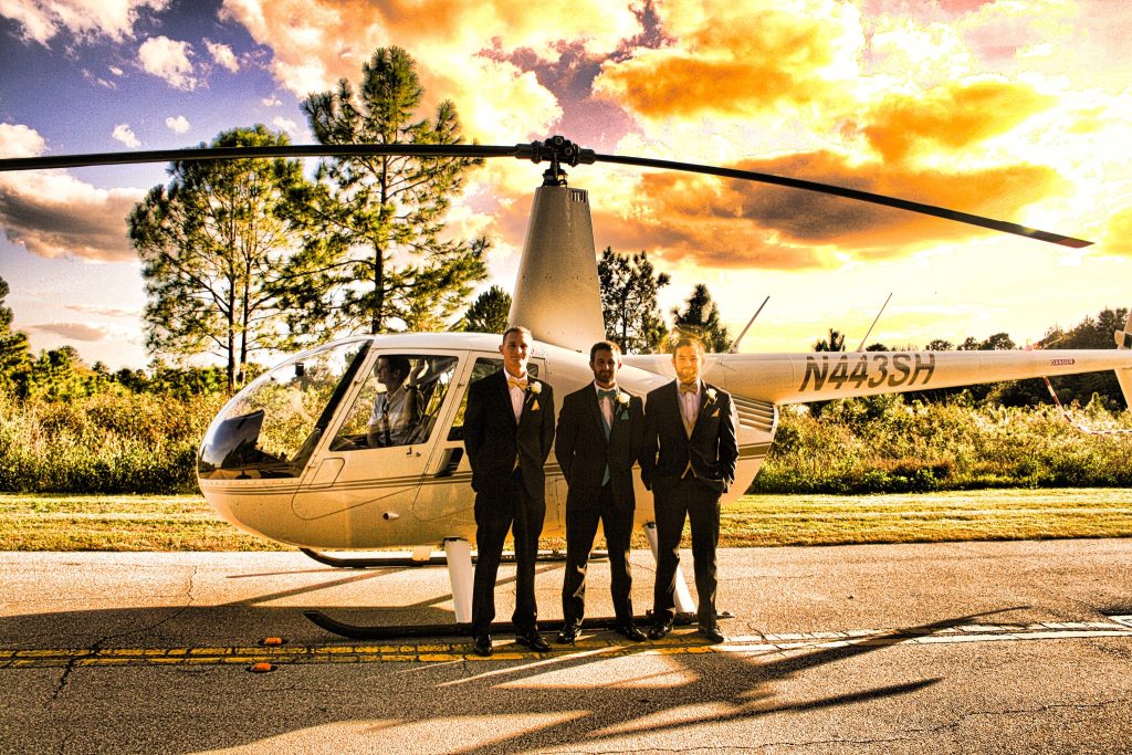 groom and his groomsmen standing in front of a helicopter, at sunset, Falcon's Fire Golf Club, Orlando, FL