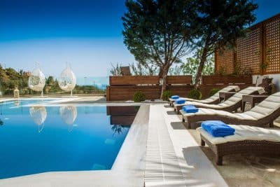 poolside, lounge chairs, blue towels, clear blue skies, private area, Orlando, FL