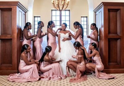 bride and her wedding attendants in the bridal suite, getting ready for the wedding ceremony, pink dresses, Daylin Lavoy Photography, Orlando, FL