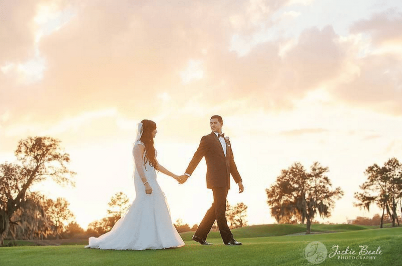 bride and groom walking on the golf course at sunset, Orlando, FL