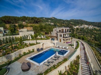 aerial view of the pool area in the shape of an L, view of the entire property for the villas, Wine Dark Sea Villas, Orlando, FL