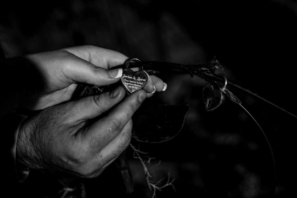 couple's hands intertwined while holding a keychain, Falcon's Fire Golf Club, Orlando, FL